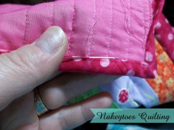 Hand sewing down the binding on the American Girl Doll Quilt